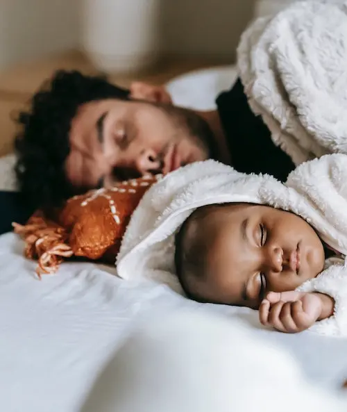 sleeping baby with father